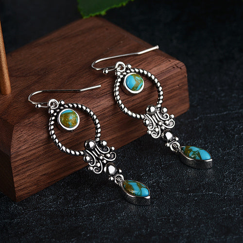 Vintage pair of earrings are pure 925 sterling silver. Embedded Turquoise Gemstone gives it an alluring look.