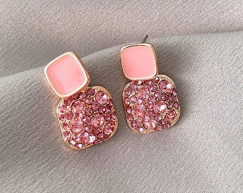 925 Silver Pink Square Love Earrings will surely tickle you pink with their glam and cuteness. It radiates love and light energy.